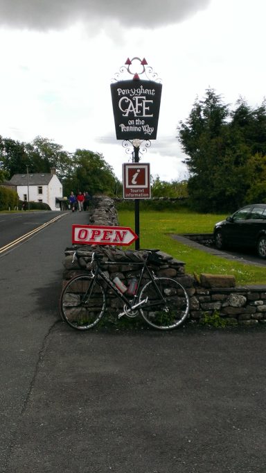 1st 100 A Principia cycle leaning against the sign for the Pen-y-ghent cafe