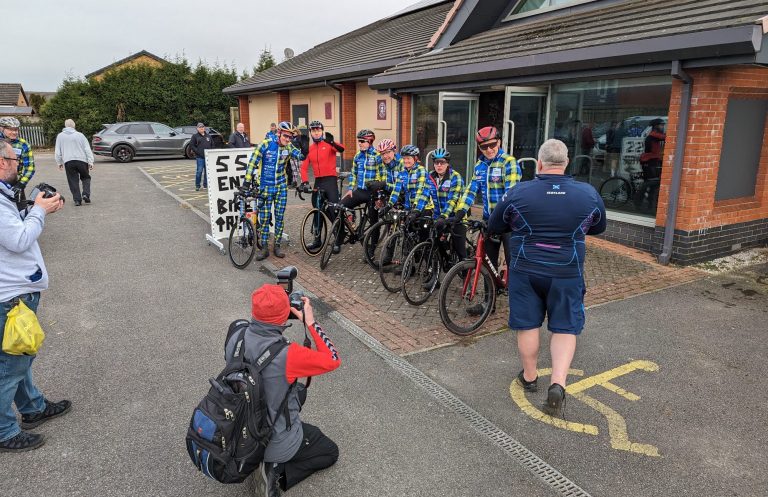 May I take your photo? The lead group of Sir Chris Hoye, Rob Wainwright, Hank from GCN, my friend Debs and others, at the start of another stage of the Doddie 555.